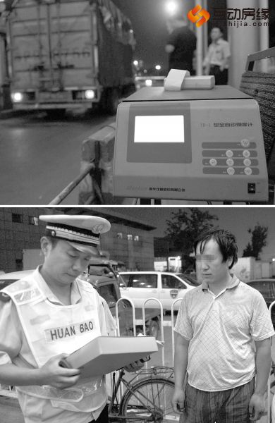 环境监察人员对进京的尾气排放超标的货车进行处罚 （图片来源：经济参考报）