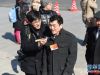 3月3日，中国人民政治协商会议第十二届全国委员会第三次会议在北京人民大会堂开幕。这是记者在采访抵达天安门广场的全国政协委员。